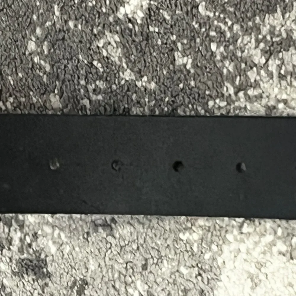 Confederate Civil War-style belt buckle on a Levis’s black leather belt L 38-40